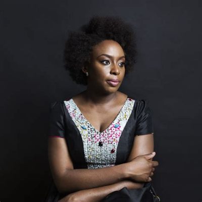 how did reading books by african writers affect adichie? and what insights did she gain about storytelling and cultural identity?